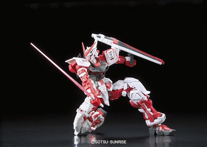 Gundam Astray Red Frame model kit in dynamic pose, showcasing red and white armor with katana and shield.