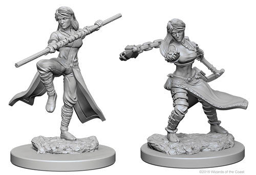 Unpainted miniature of a human female monk from Dungeons & Dragons, featuring dynamic poses and detailed sculpting.