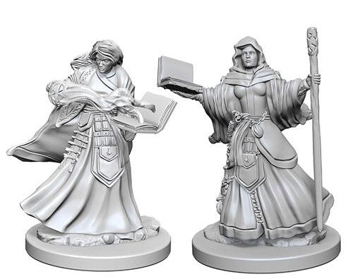 Unpainted miniatures of two female wizards from Dungeons & Dragons, featuring detailed robes and spellcasting poses.