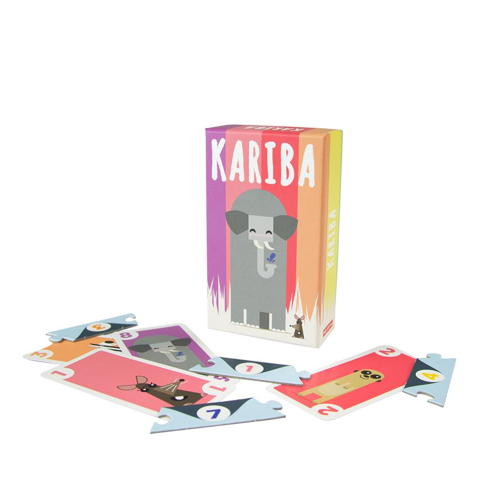 Colorful box of the Kariba card game featuring an elephant design, with scattered puzzle-like animal cards around it.