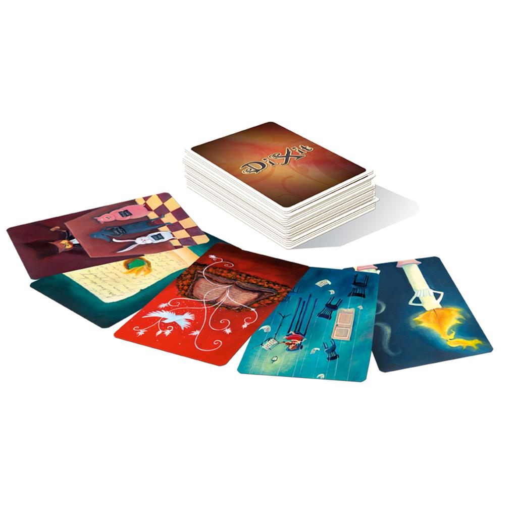 Dixit: Quest Expansion featuring a stack of illustrated cards and several cards laid out, showcasing imaginative artwork.