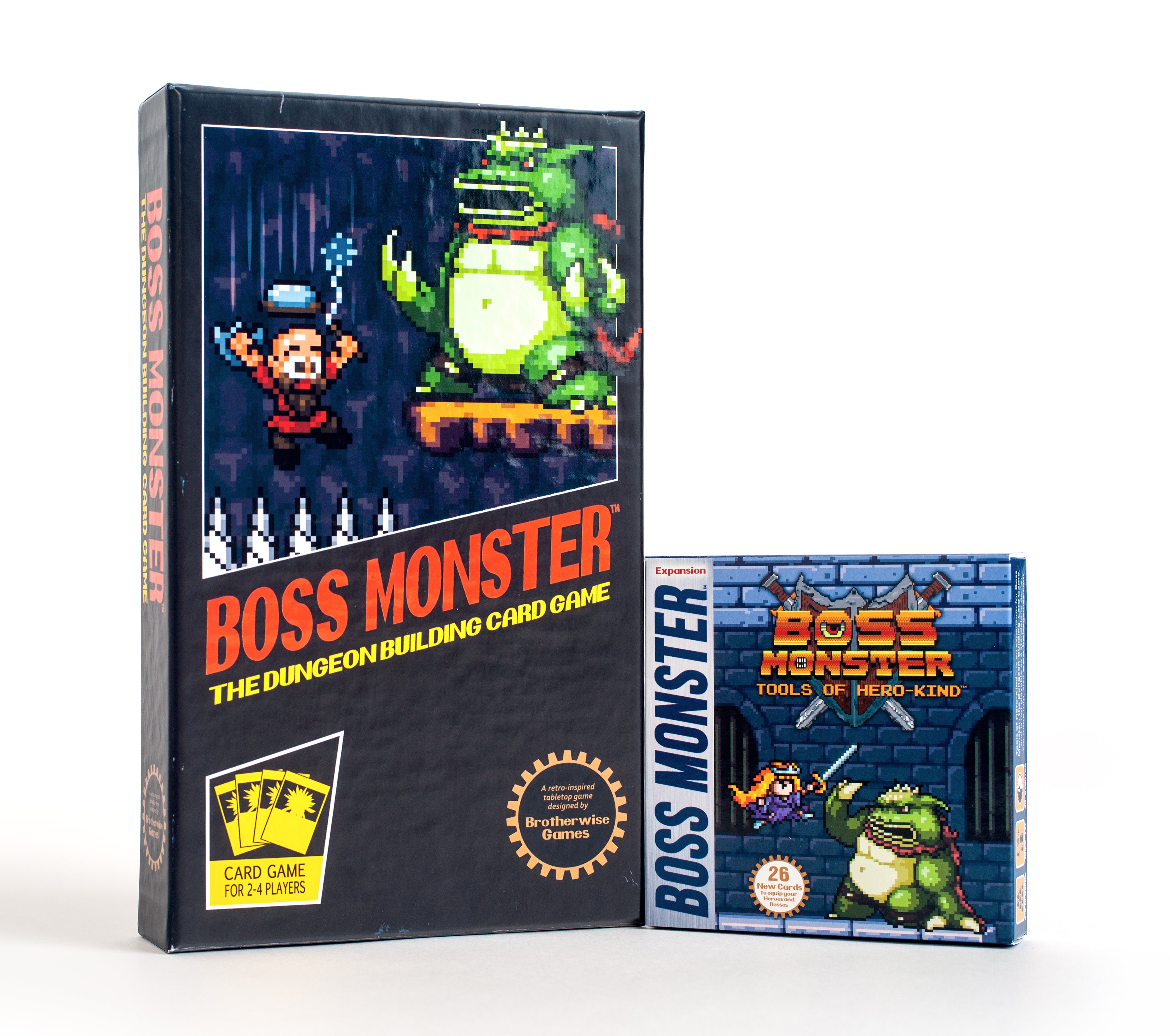 Boss Monster: Tools of Hero-Kind expansion box alongside the main game, featuring pixel art characters and vibrant colors.