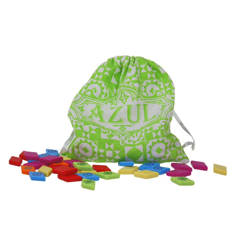 Green drawstring bag with "Azul" logo, surrounded by colorful tiles in various shapes for the game Azul Summer Pavilion.