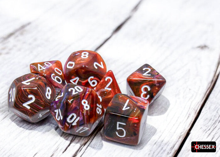 Chessex Festive Symphony/White Polyhedral 7-Dice Set featuring vibrant red and orange swirls with white numbering.