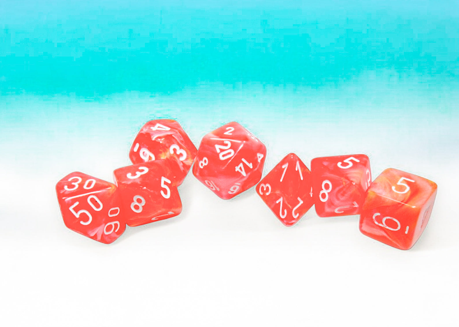 Chessex Festive Dahlia/White Luminary polyhedral 7-dice set featuring vibrant red dice with white numbers.