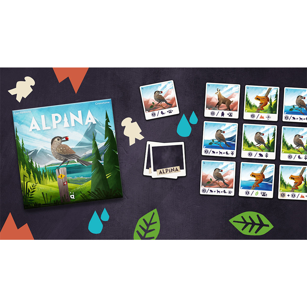 Colorful board game Alpina featuring bird illustrations, game cards, and a scenic mountain backdrop.