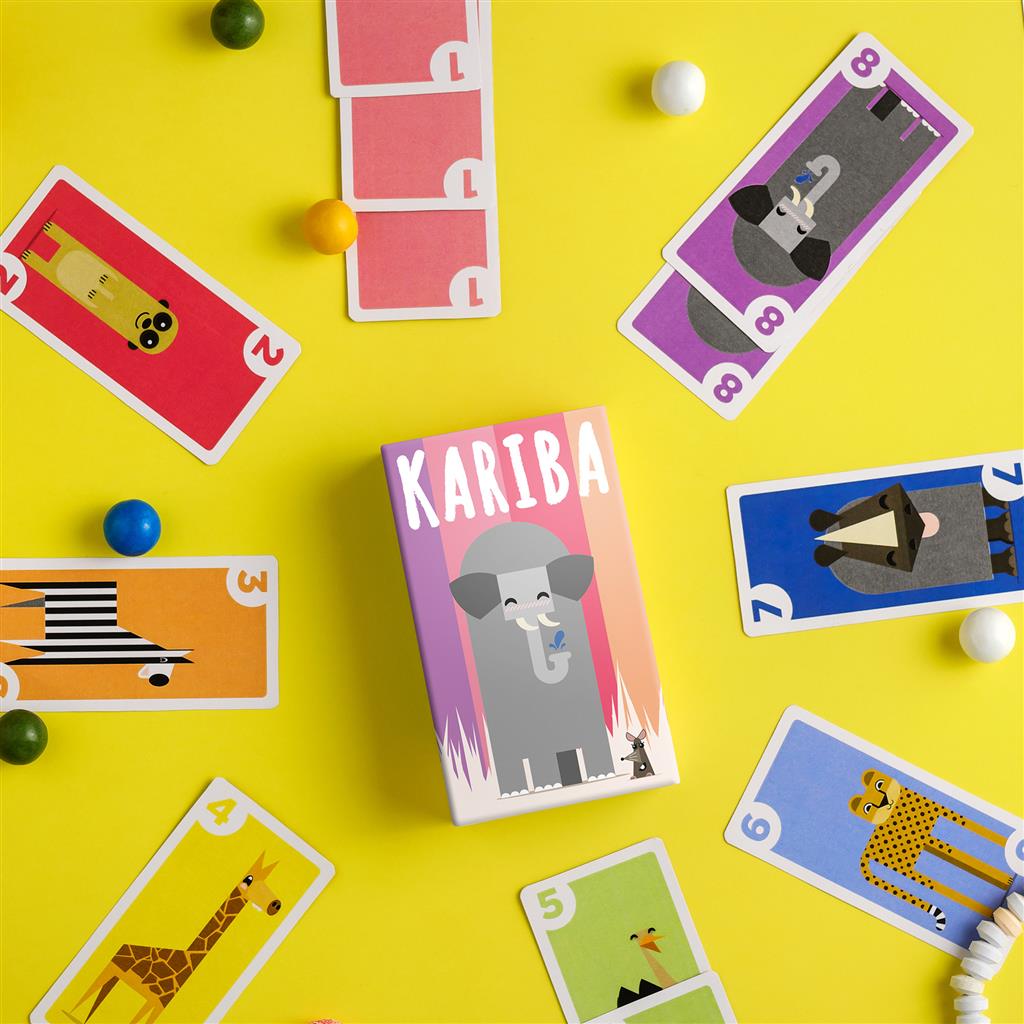 Colorful Kariba card game box surrounded by animal-themed cards on a bright yellow background.