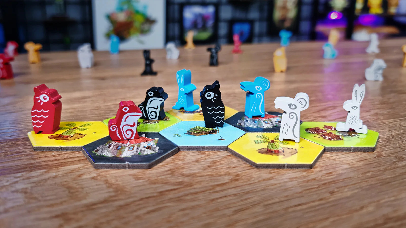 Colorful game pieces in various animal shapes on hexagonal tiles, set in a vibrant board game environment.