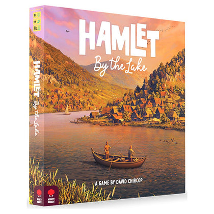 Box cover of "Hamlet: By the Lake," featuring a serene lakeside village with boats and lush hills, designed by David Chircop.
