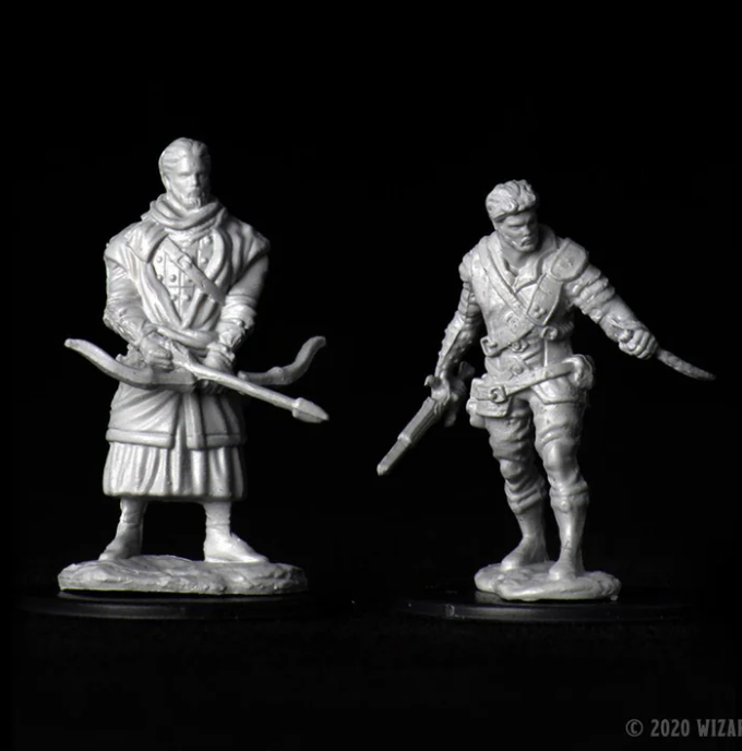 Unpainted miniatures of two male human rogues for Dungeons & Dragons, featuring detailed poses and weapons.