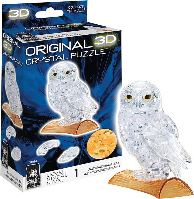 3D crystal puzzle of a white owl, featuring 42 clear pieces, displayed alongside its packaging. Ideal for puzzle enthusiasts.