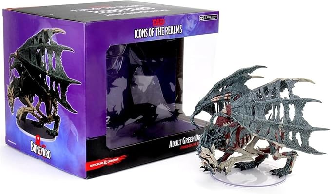 Dungeons & Dragons Boneyard Green Dracolich miniature displayed beside its packaging, showcasing intricate details and design.