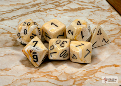 Chessex Marble Ivory and Black 7-die set featuring various polyhedral dice with bold black numbering on a marbled background.