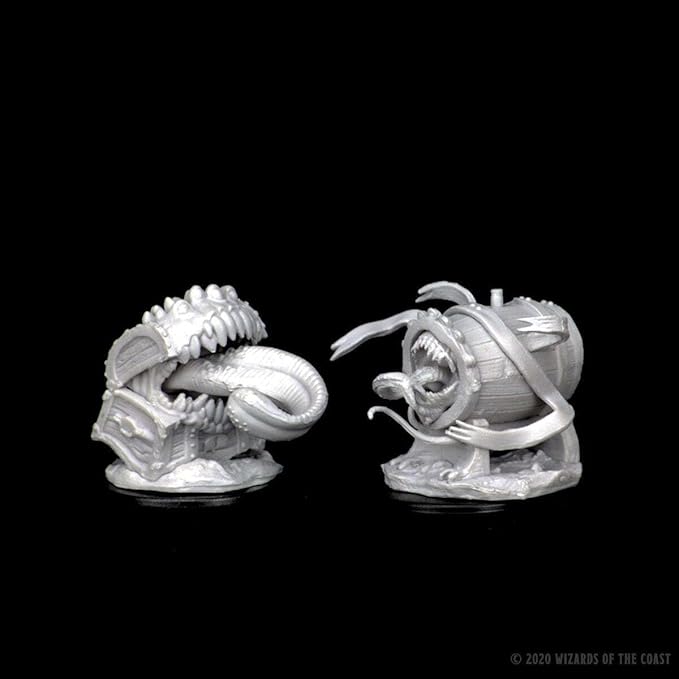 Unpainted Dungeons & Dragons miniatures featuring two mimics: a treasure chest and a barrel, both with open mouths and tentacles.