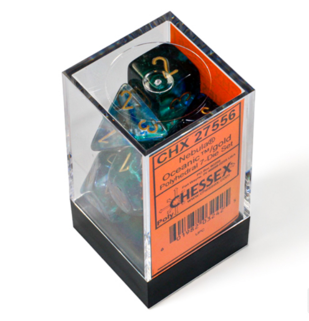Chessex Nebula Oceanic Gold Luminary 7 die set in a clear display box, featuring teal and gold polyhedral dice.