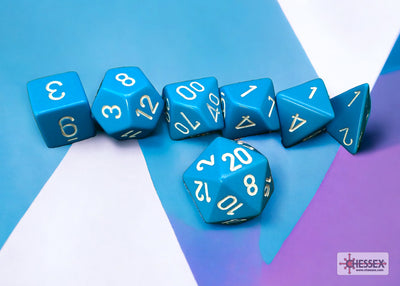 Chessex opaque light blue and white 7-die set featuring gold numbers on various polyhedral shapes.
