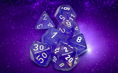 Chessex Borealis purple and white luminary polyhedral 7-die set, featuring translucent dice with clear numbering.