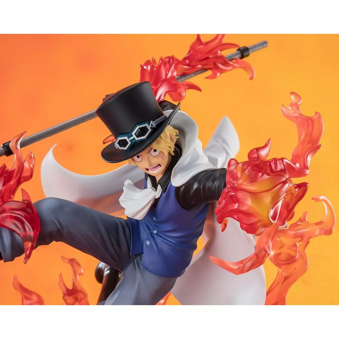 One Piece Sabo figure by Bandai Spirits features dynamic flames and a striking pose with a staff, showcasing vibrant colors.