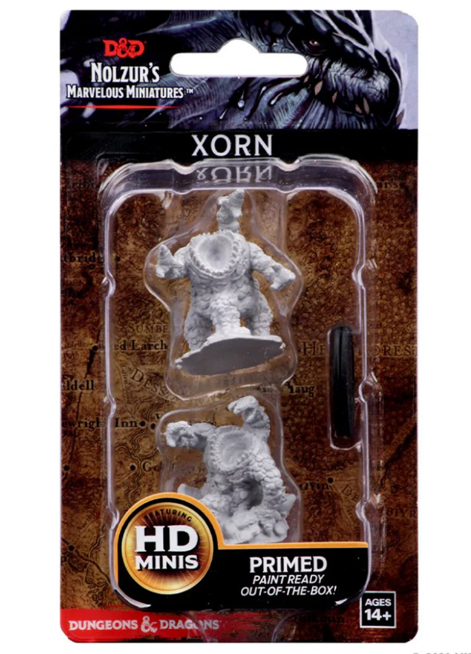 Unpainted miniature of a Xorn from Dungeons & Dragons, primed and ready for painting, displayed in packaging.