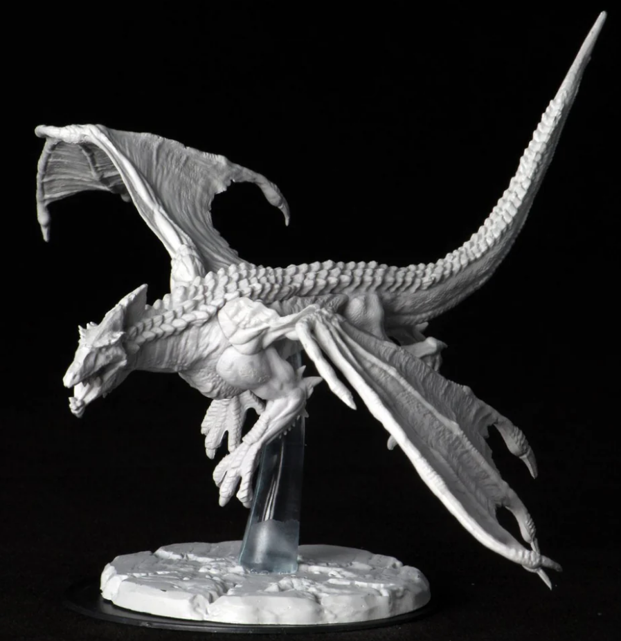 Unpainted miniature of a young white dragon from Dungeons & Dragons, featuring detailed scales and wings, mounted on a clear base.