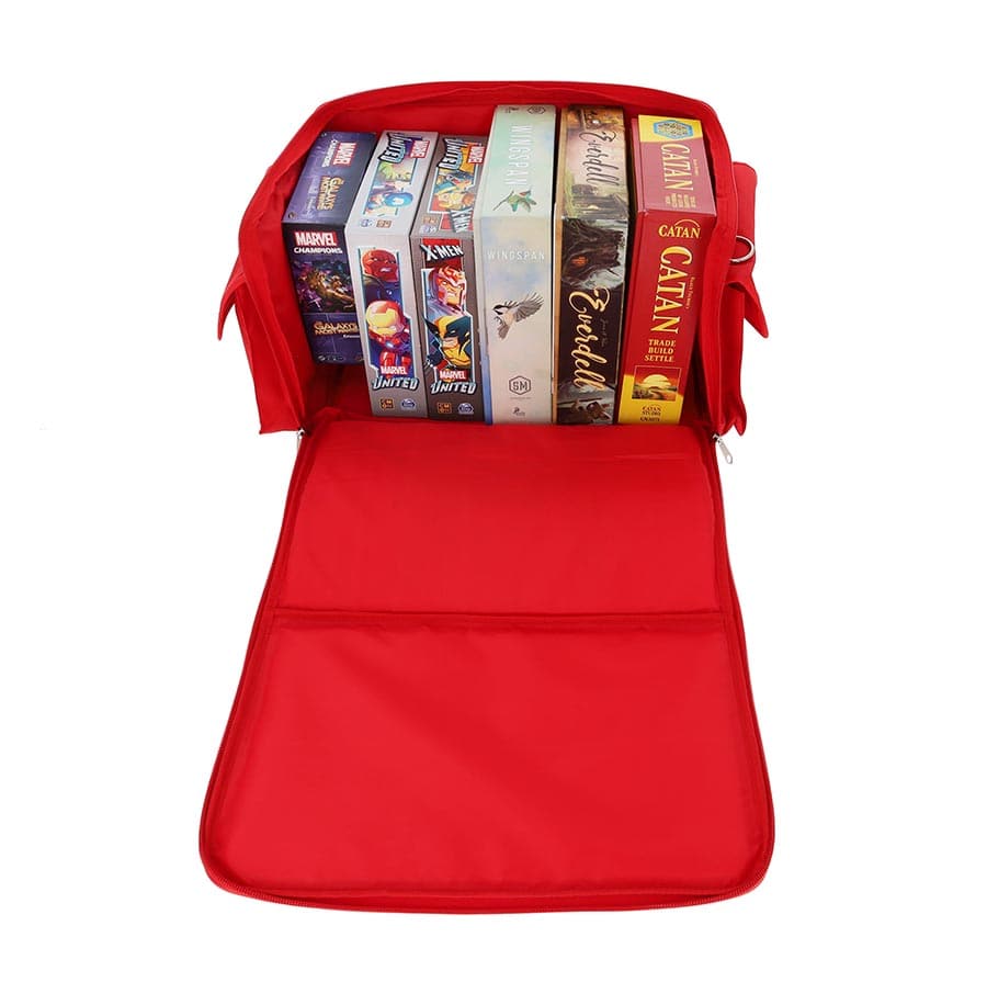 Red BCW Spectrum board game bag with multiple game boxes neatly organized inside, showcasing its spacious interior.